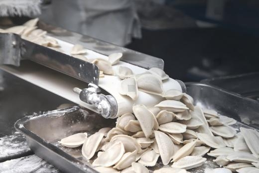 stock-photo-production-of-dumplings-a-machine-for-the-production-of-dumplings-ravioli-1033103221(1).jpg